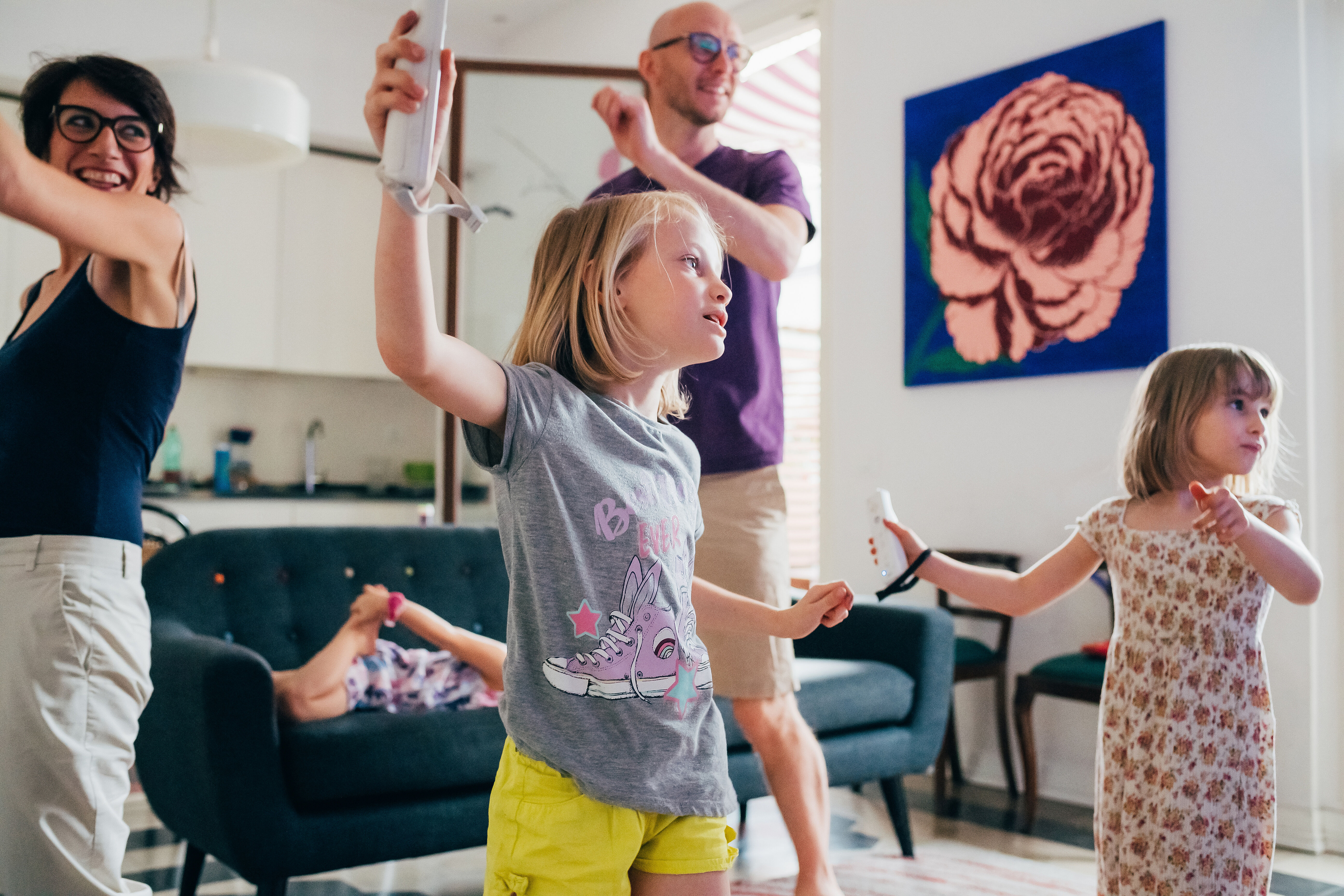 Family dancing together indoor playing videogame - healthy lifestyle, togetherness, playing concept